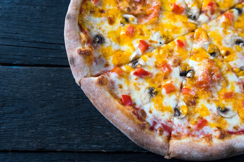 Truffle and wild mushroom pizza on wood-fired crust