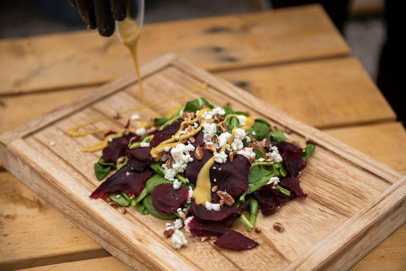 Fresh arugula salad with pears walnuts and gorgonzola