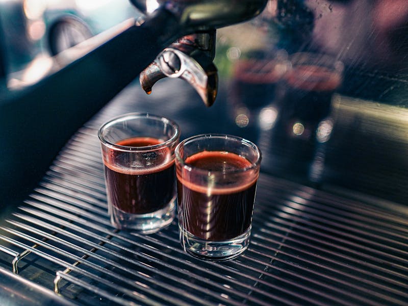 Authentic Italian double espresso served with biscotti