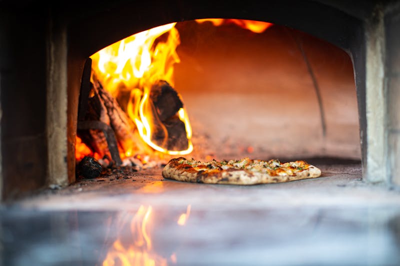 Authentic wood-fired oven at Punch pizza restaurant