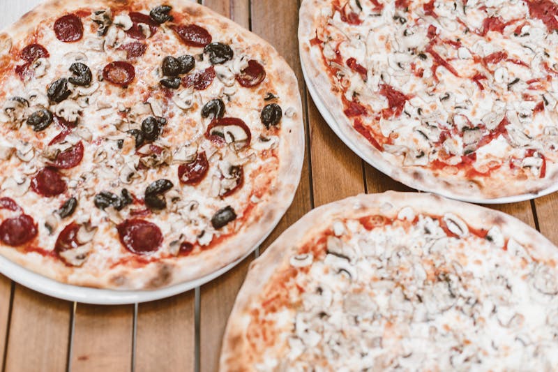 Spicy Arrabbiata punch pizza with chili oil and roasted peppers